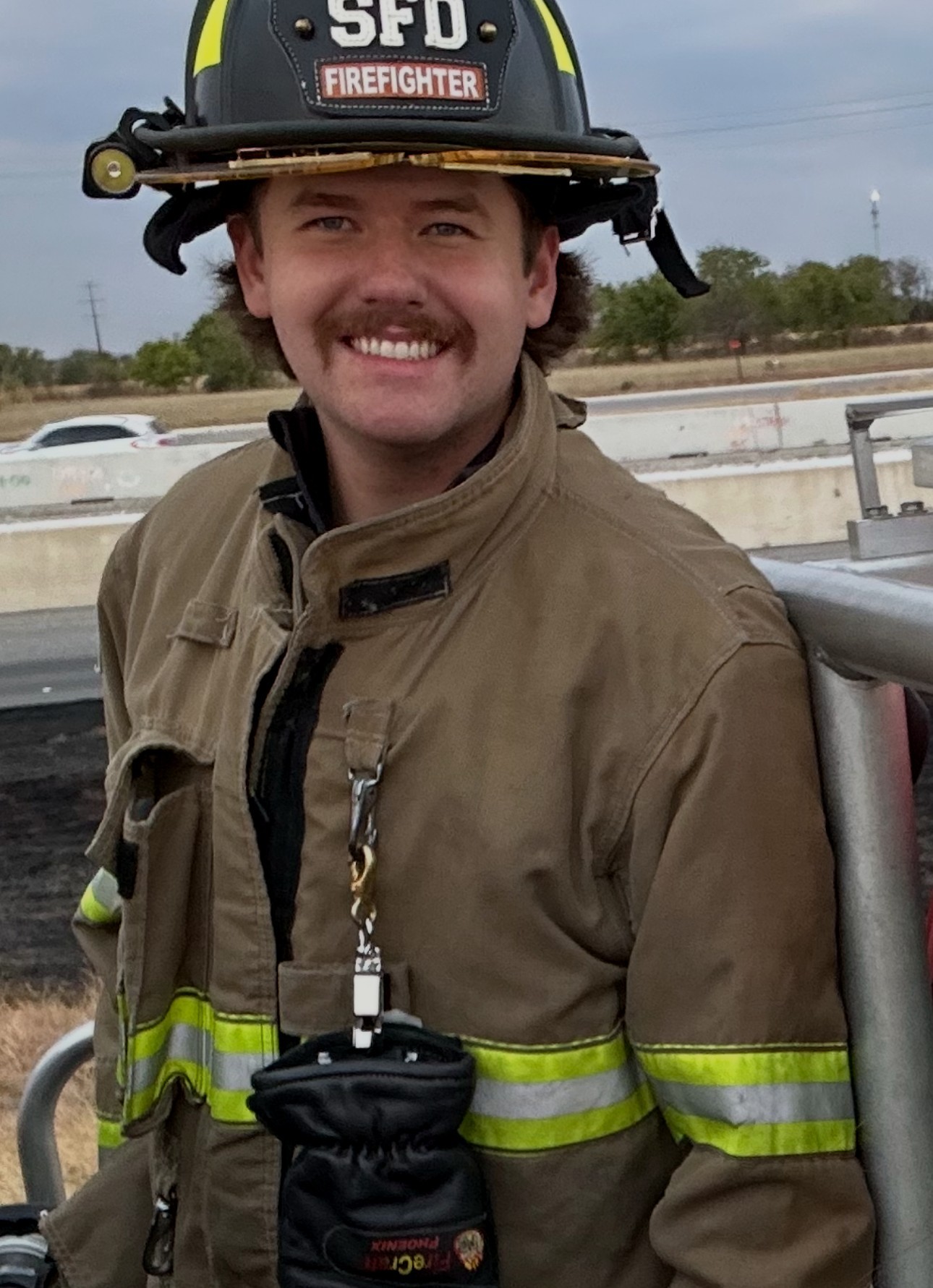 Alec Grandstaff in firefighter turnout gear